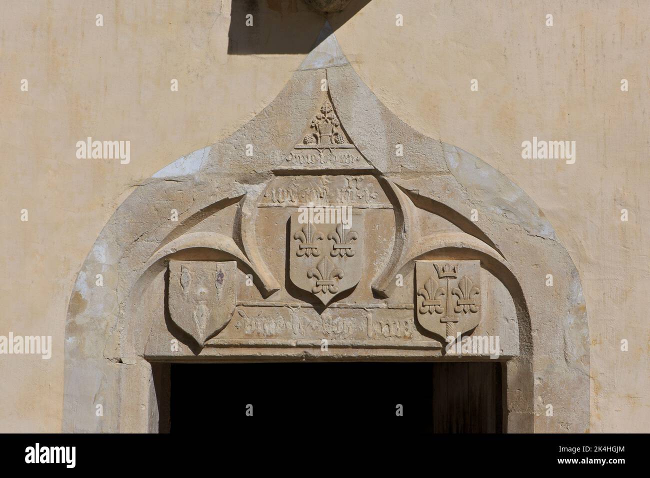 The family crest (coat of arms) above the entrance door of the birthplace of Joan of Arc (1412-1431) in Domrémy-la-Pucelle (Vosges), France Stock Photo