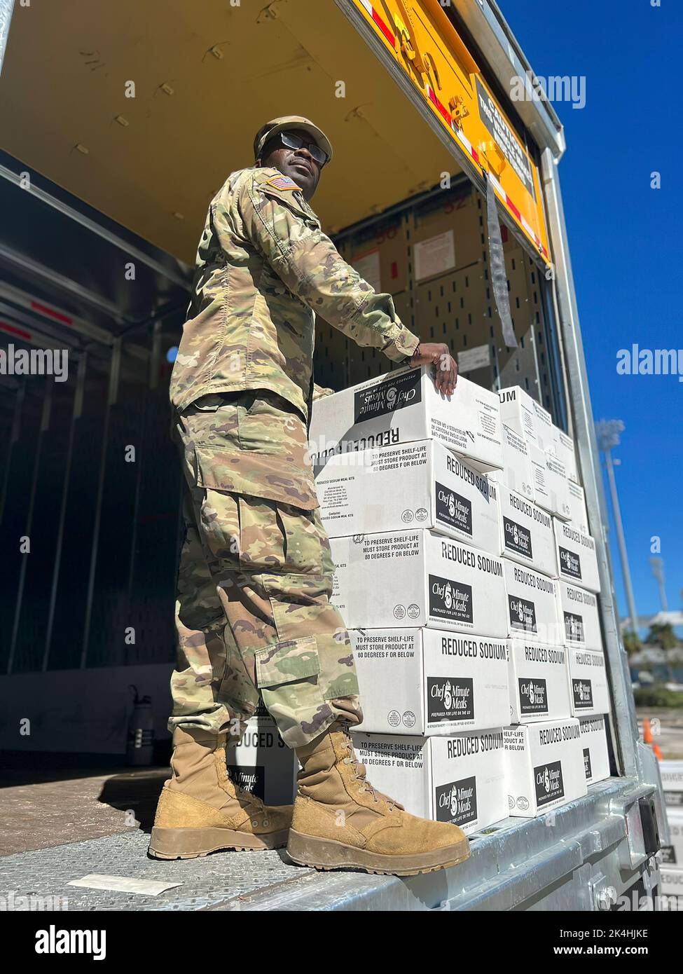 Sgt. Jesmond Russ, a mechanic with the 144th Transportation Company prepares to hand out food to civilians affected by Hurricane Ian September 30, 2022 Port Charlotte, Fla. The Florida National Guard has been assisting state and local authorities in the aftermath of Hurricane Ian. Stock Photo