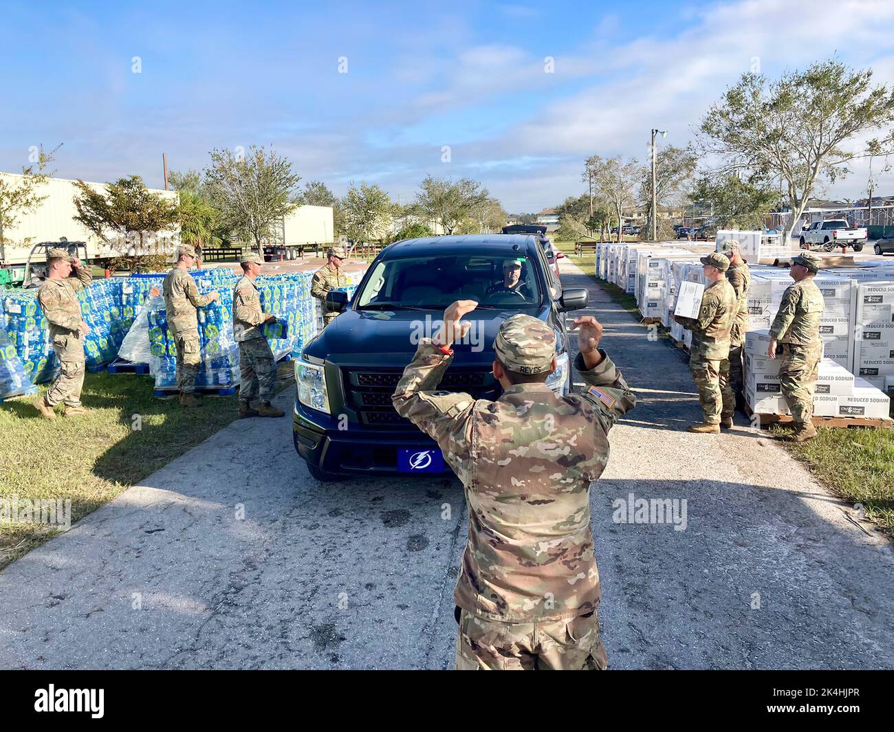 Soldiers from 1-124th Battalion providing food, water and ice at the point of distribution (POD) center located at Flea Market Fun, 4135 Martin Luther King Jr Blvd Fort Myers, FL 33916. This is one of the several PODs providing support to those impacted by Hurricane Ian. Stock Photo