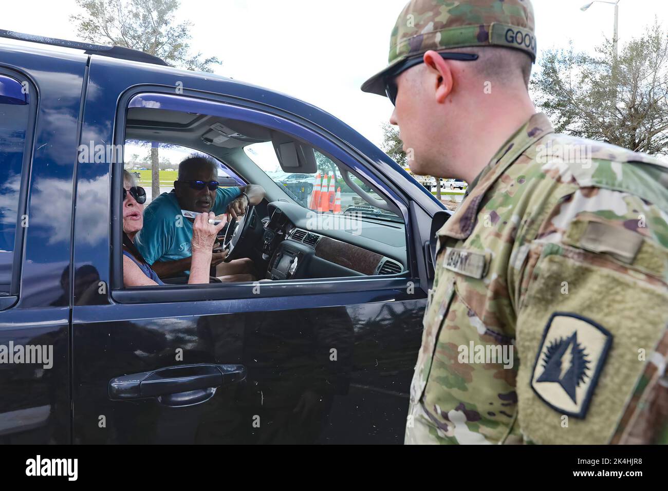 Couple stops to say thank you to the National Guard Soldiers providing them with food and water after Hurricane Ian’s devastation in Port Charlotte, Fla. Oct. 1, 2022. The Florida National Guard has been assisting citizens with Hurricane Ian relief. Stock Photo