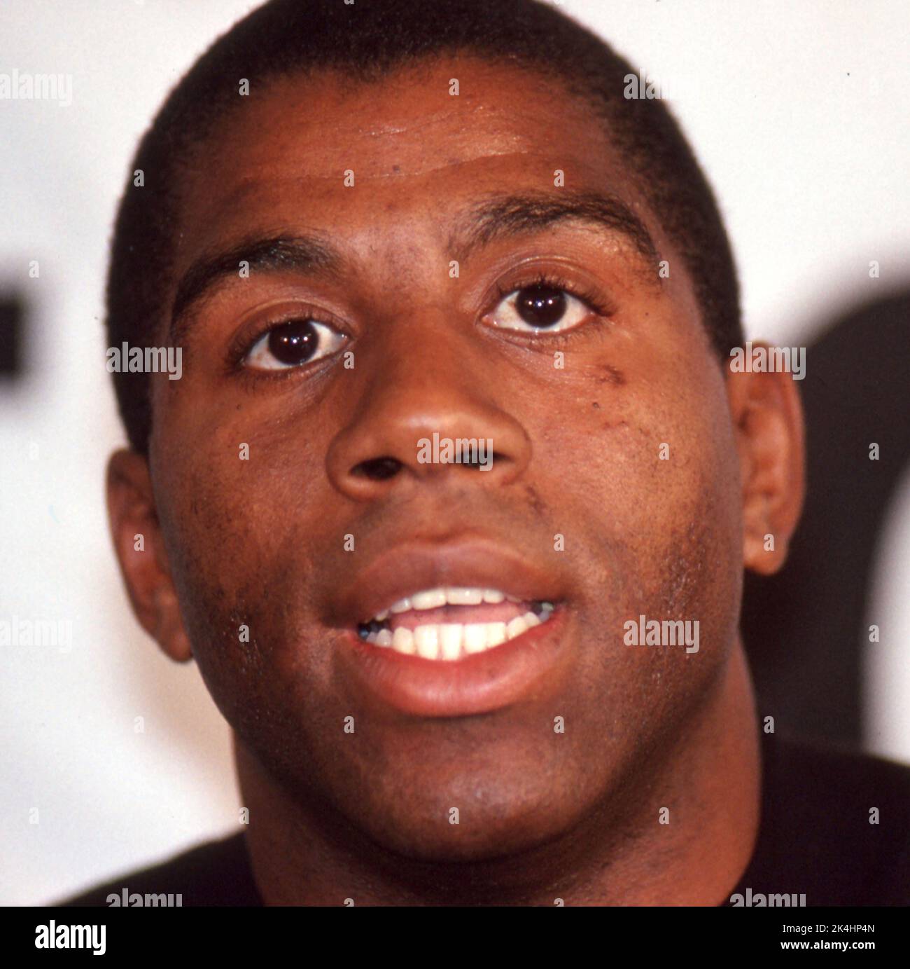 NBA superstar Ervin 'Magic' Johnson is shown at a press conference in Chicago Illinois shortly after announcing that he had contracted AIDS in 1991. Stock Photo