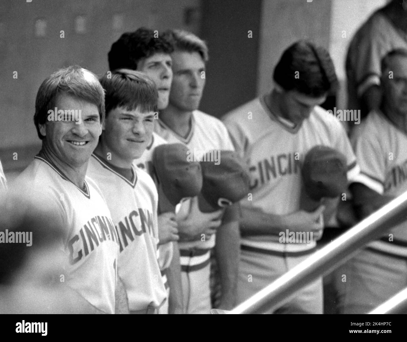 Pete Rose manager / player of the Cincinnati Reds stands next to his son, Pete Rose, Jr. during the national anthem at Wrigley Field,  ca. 1985 Stock Photo