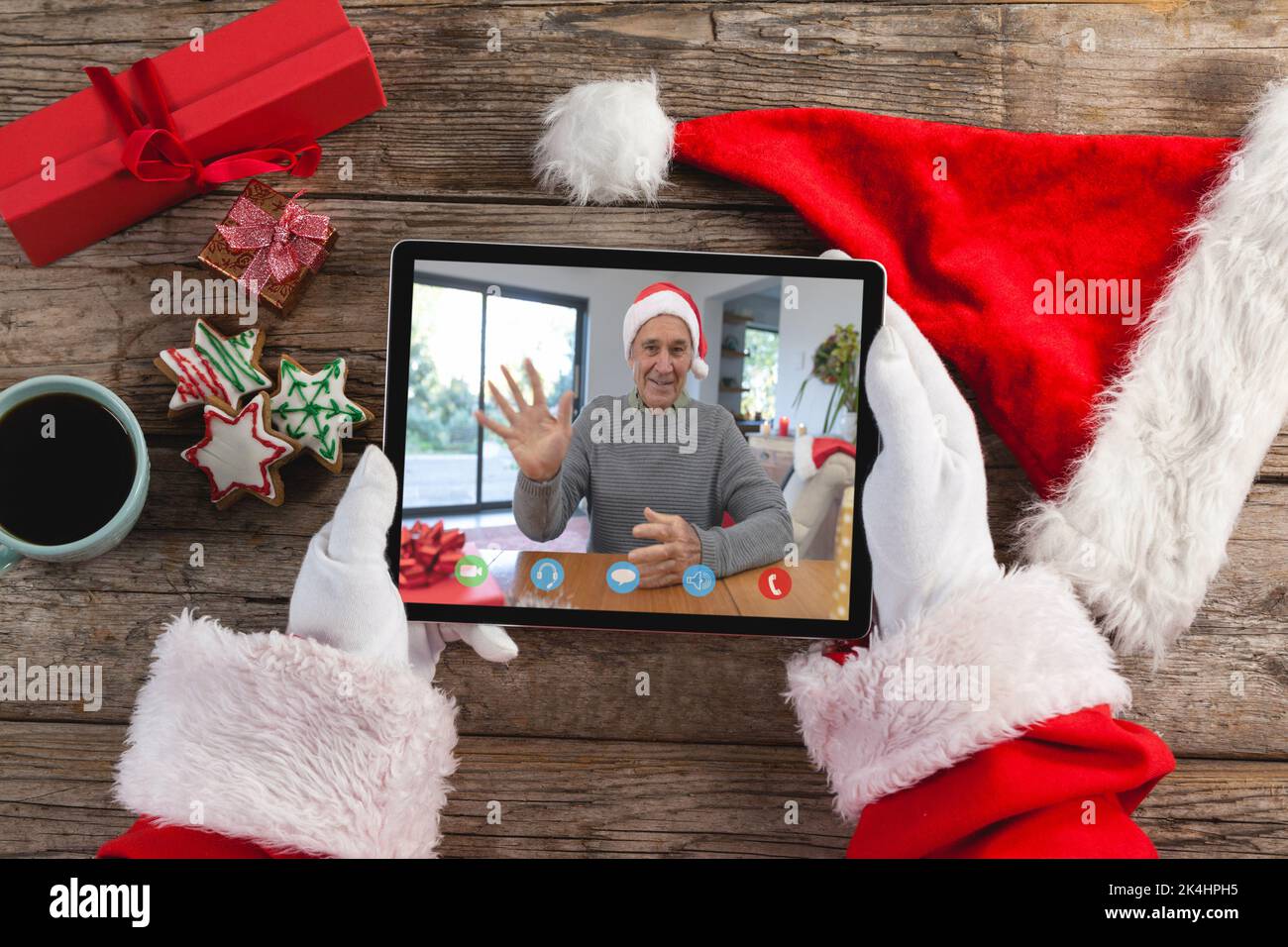 Santa claus holding tablet, making christmas video call with waving ...