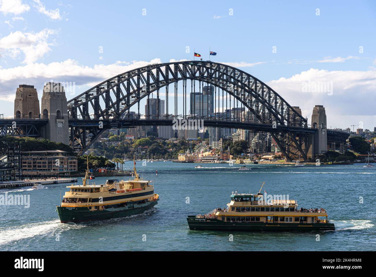The Freshwater and Fred Hollows (Emerald Class) ferries approaching the Circular Quay Ferry Wharf with the Sydney Harbour Bridge in the background Stock Photo