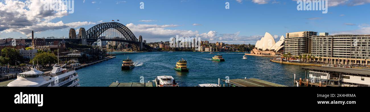 A panoramic view of ferries approaching the Circular Quay Ferry Wharf Stock Photo