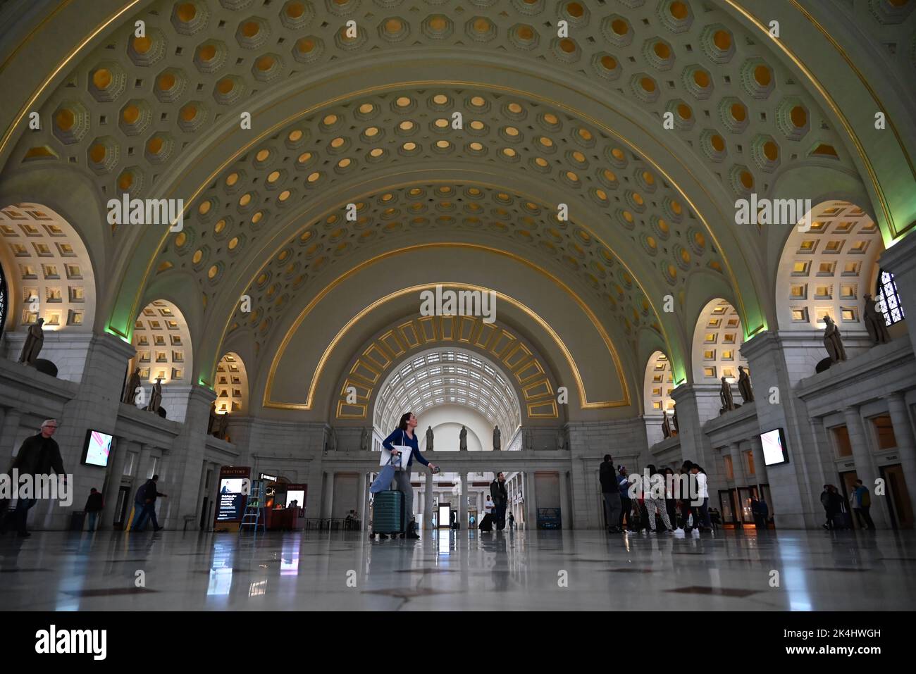 Passengers walk through the Great Hall on their way to their train at