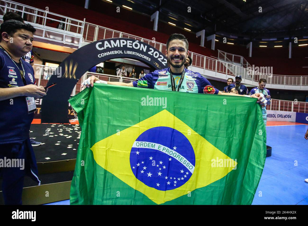 Buenos Aires, Argentina. 02nd Oct, 2022. Di Fanti of Cascavel (BRA) seen with a Brazil flag during the award ceremony of Libertadores Futsal 2022 at Befol Arena in Buenos Aires. (Photo by Roberto Tuero/SOPA Images/Sipa USA) Credit: Sipa USA/Alamy Live News Stock Photo