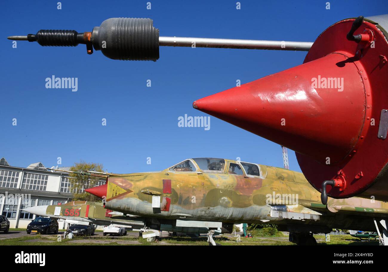 29 September 2022, Saxony-Anhalt, Dessau-Roßlau: On the grounds of the 'Hugo Junkers' Museum of Technology there is a MIG-21 K-400 fighter (in front) and a Su-22 UM-3K training fighter from the GDR Army. They are among the exhibits in the museum dedicated to the aircraft designer and entrepreneur Hugo Junkers (Hugo Junkers born February 3, 1859 - died February 3, 1935). The museum, which opened in 2001 on the site of the former Junkers aircraft factory, is run by the Förderverein Technikmuseum 'Hugo Junkers' e. V. (Hugo Junkers Technology Museum Association). It has around 200 members. Of thes Stock Photo
