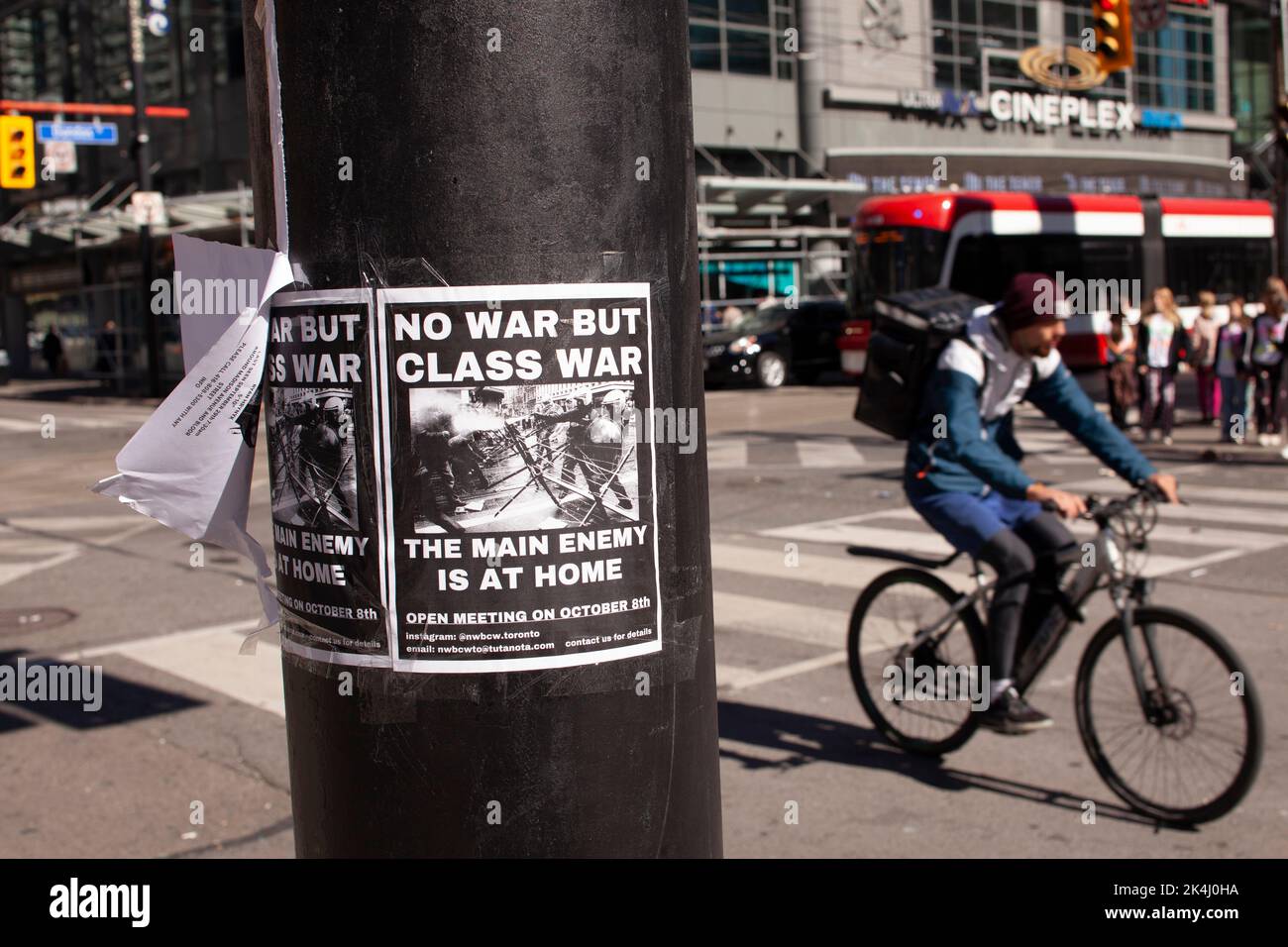 class war poster on the street pole , intersection of Dundas and Younge street, Toronto, Canada Stock Photo