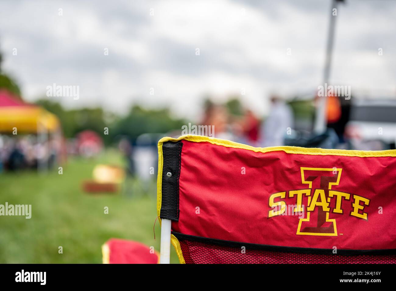 Ames, Iowa, USA - 9.2022 - Selective focus on lawn chair with I-State Logo at a football tailgate.  Stock Photo