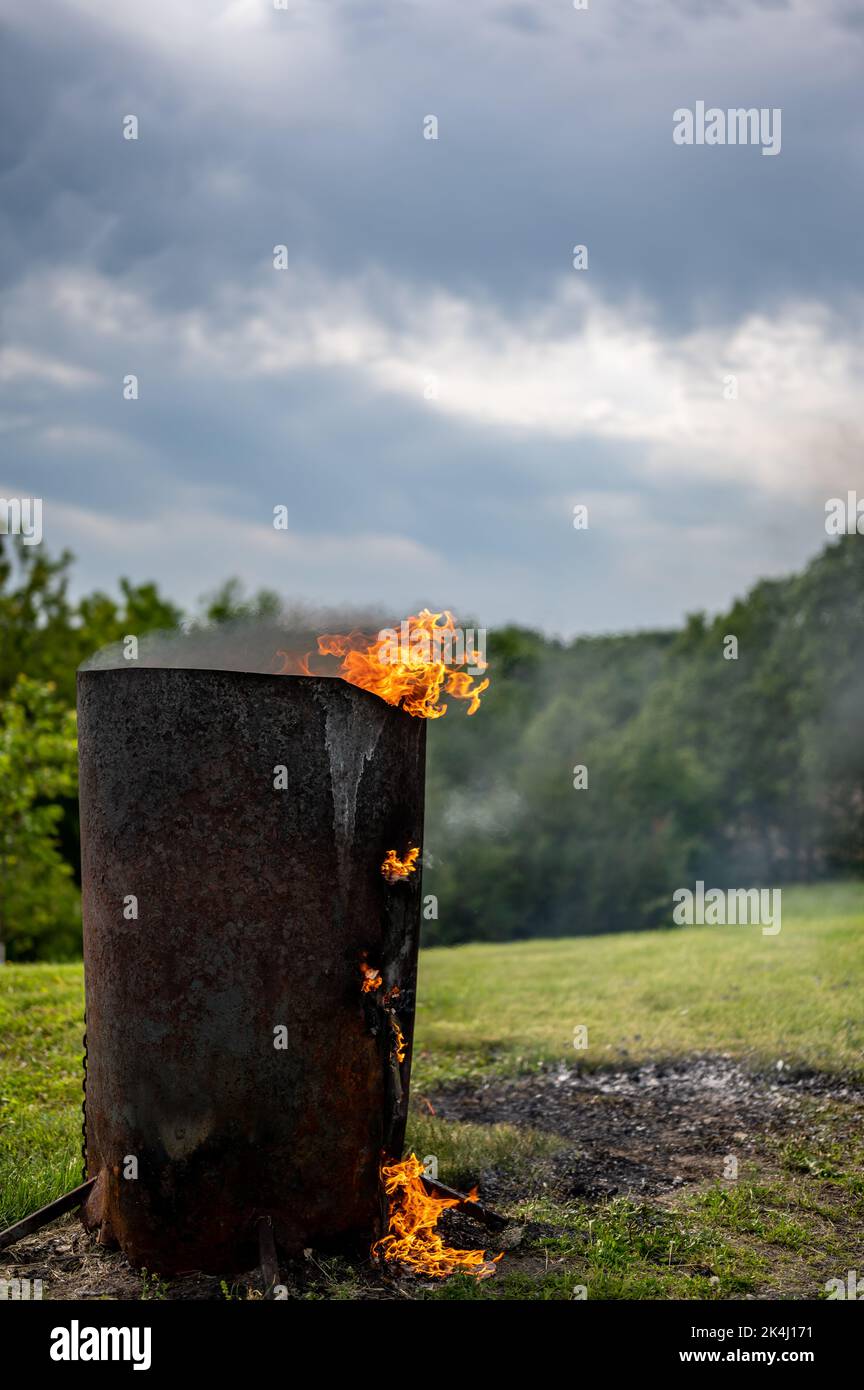 Burn barrel in a rural area used to incinerate trash and garbage Stock