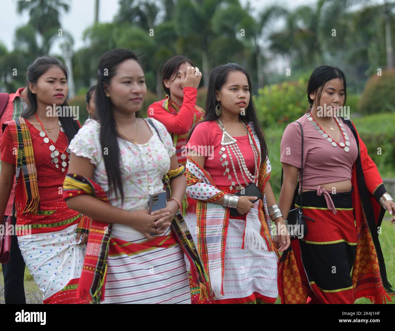 Indigenous people are walking with traditional folk dresses during a ...