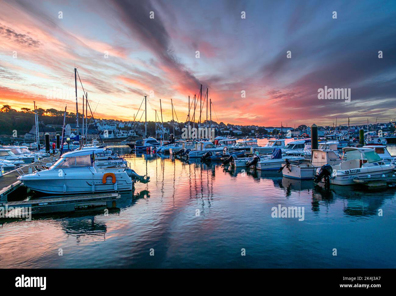Breathtaking colorful sunrise over the harbor of Audierne, Brittany, France Stock Photo