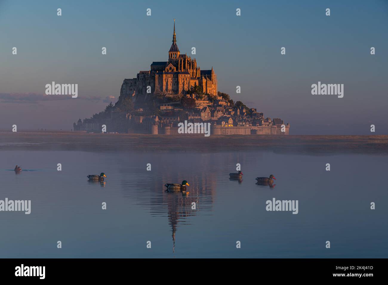 Breathtaking sunrise at the famous Le Mont Saint-Michel tidal island , Normandy, France Stock Photo