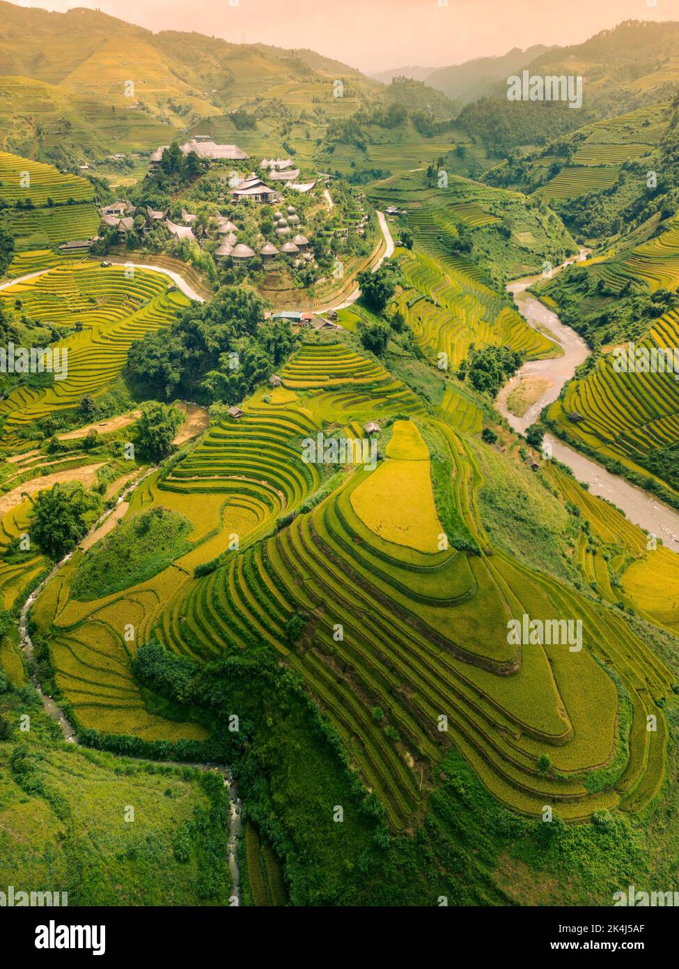 Aerial view of golden rice terraces at Mu cang chai town near Sapa city ...