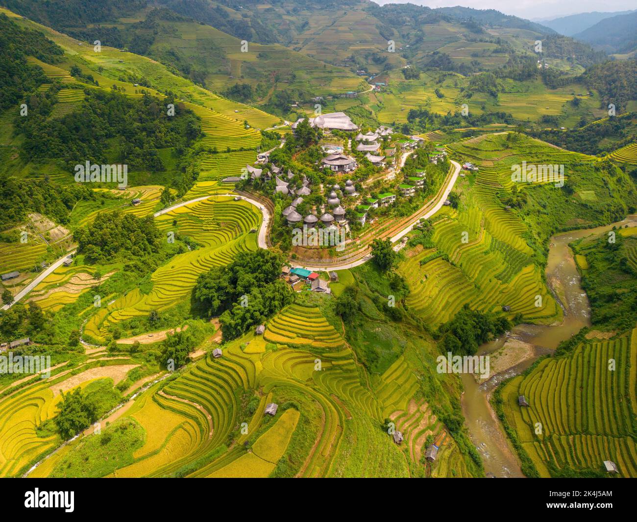 Aerial view of golden rice terraces at Mu cang chai town near Sapa city ...
