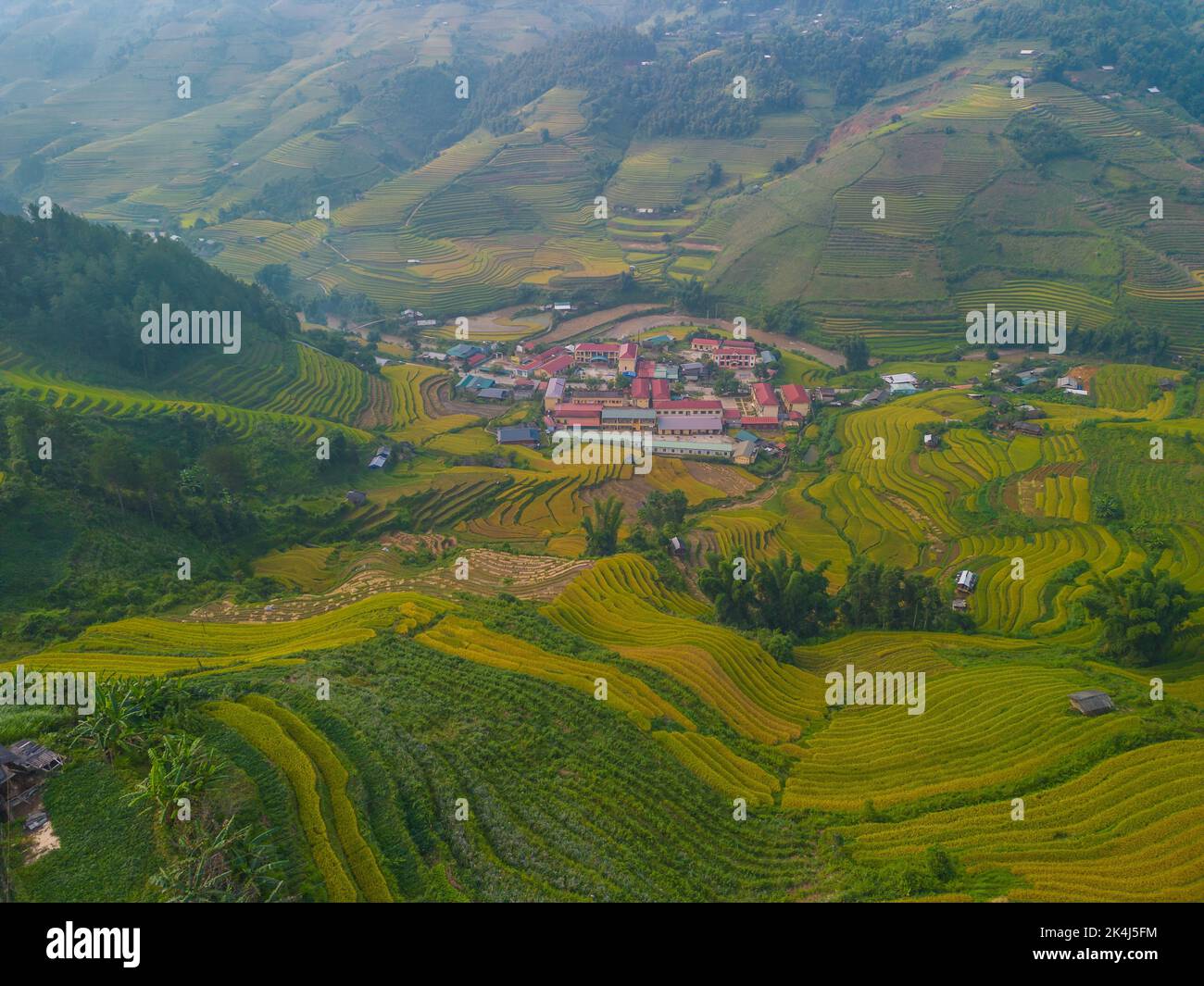 Aerial view of golden rice terraces at Mu cang chai town near Sapa city ...