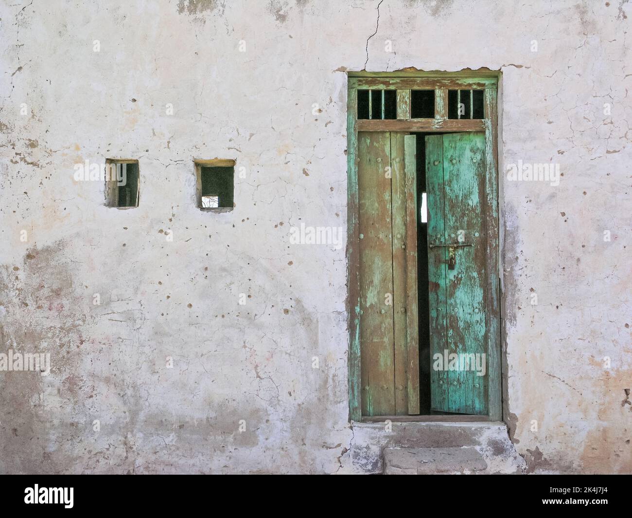 The entrance to an old dilapidated canteen in Tawi Fili in the emirate of Sharjah in the United Arab Emirates. Stock Photo