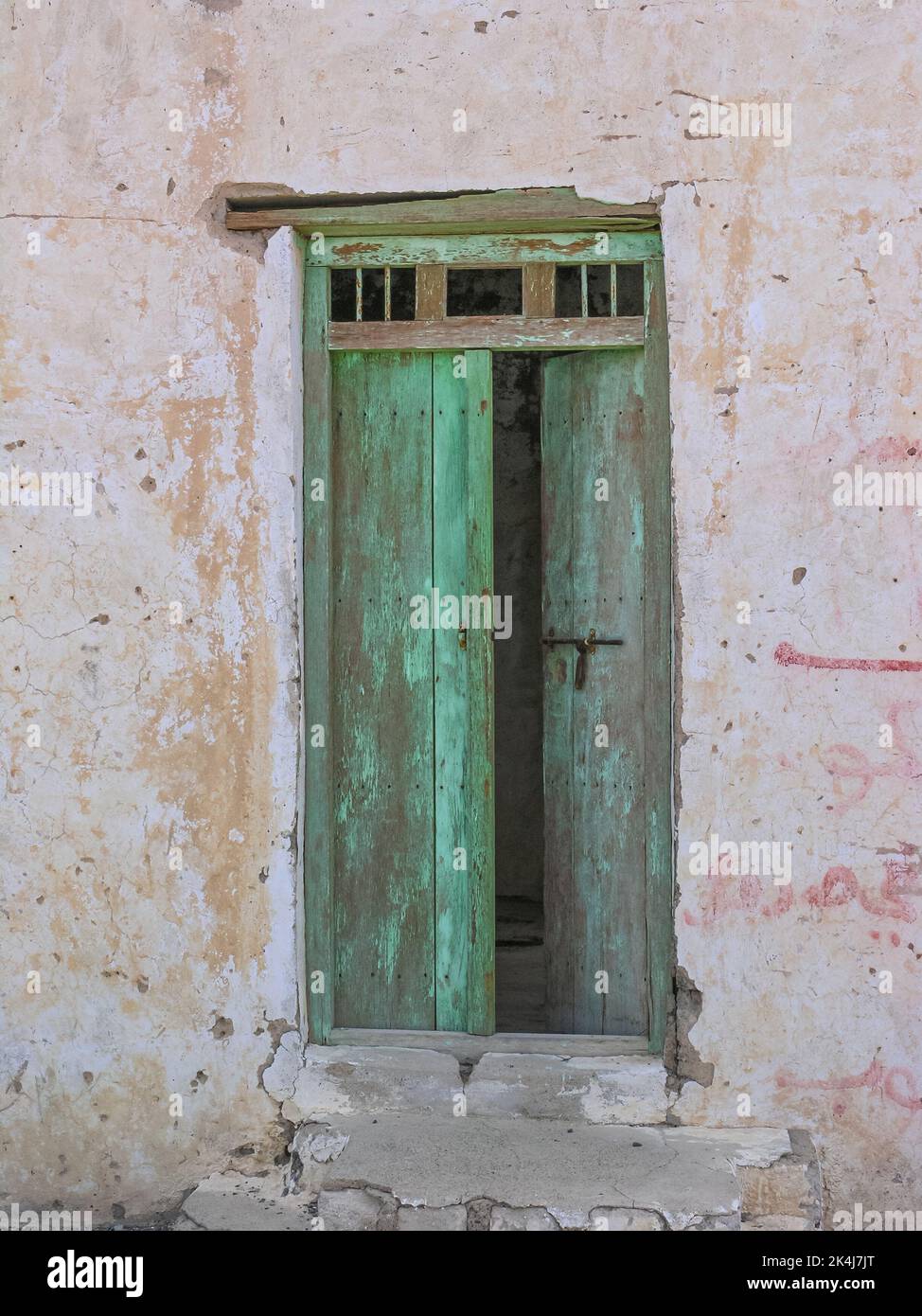 The entrance to an old dilapidated canteen in Tawi Fili in the emirate of Sharjah in the United Arab Emirates. Stock Photo