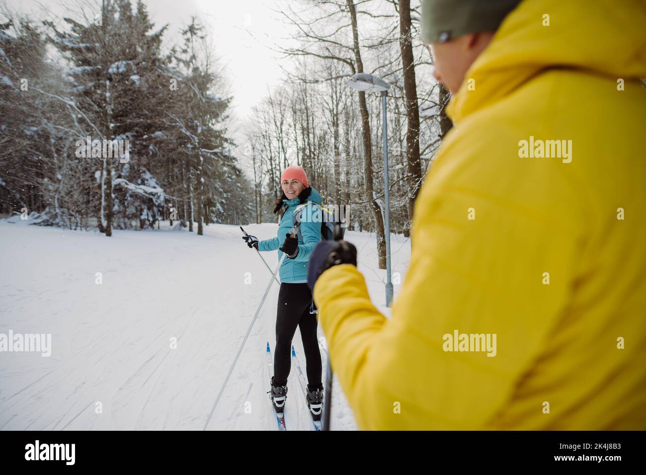 Senior couple skiing togetherin the middle of forest Stock Photo