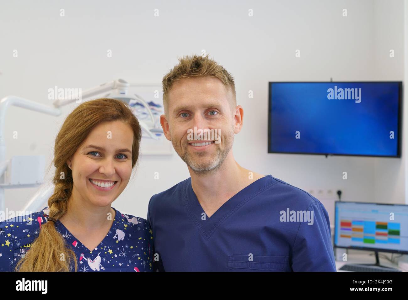 Dentist posing with a nurse in dentists ambulance. Stock Photo