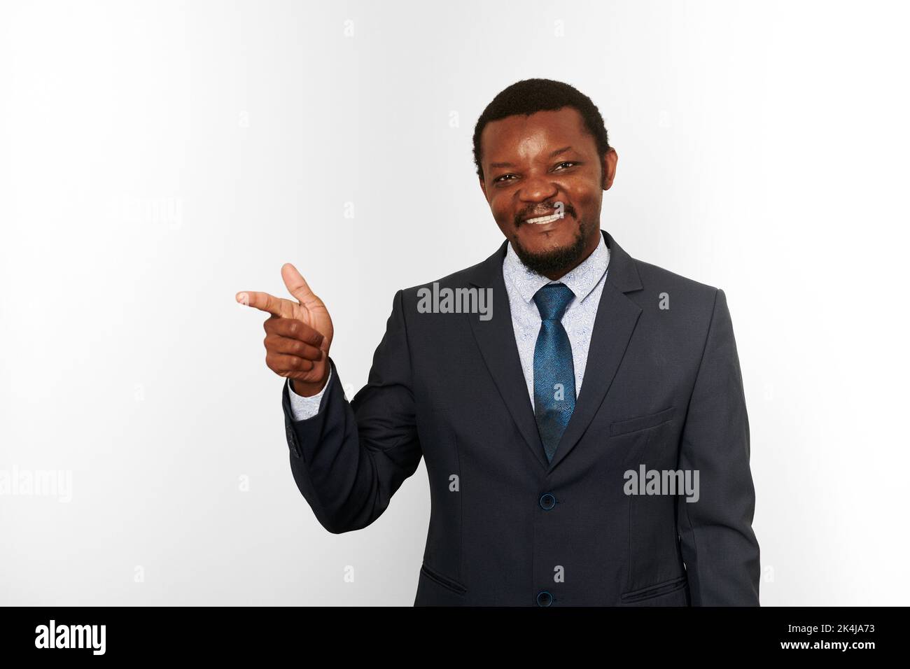 Smiling african american black man in business suit pointing finger ...