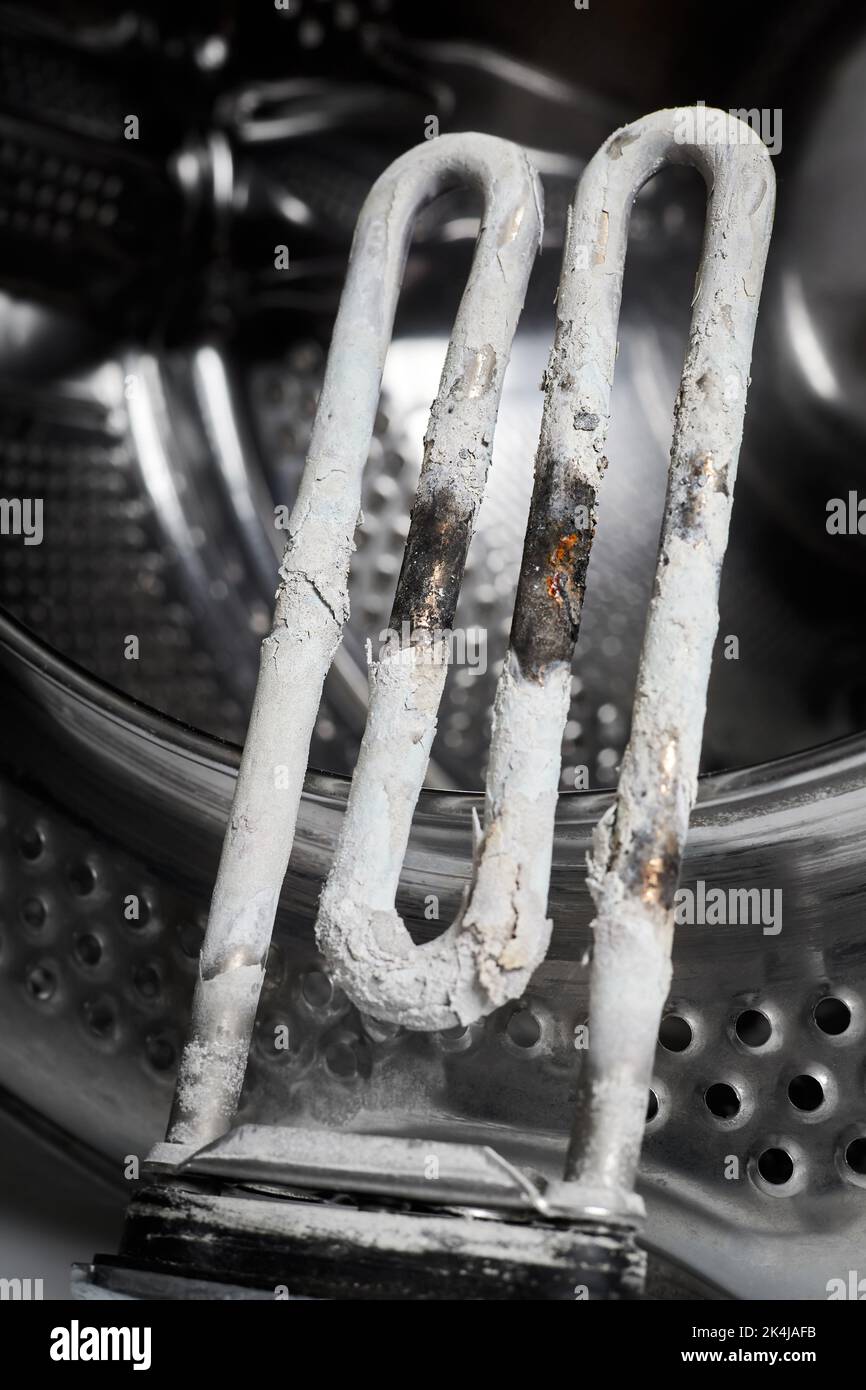 A burntout heating element of a washing machine against the background
