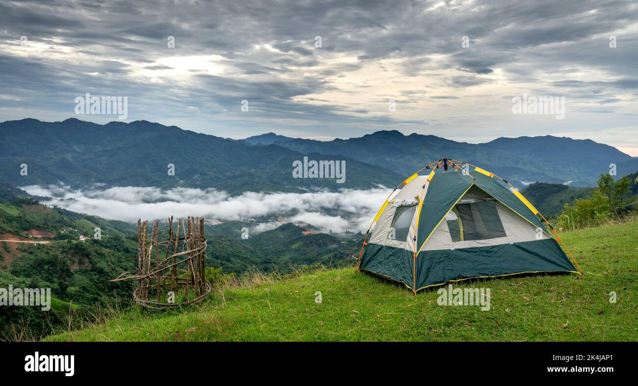 The tent camping on the top of the mountain, overlooking the valley ...