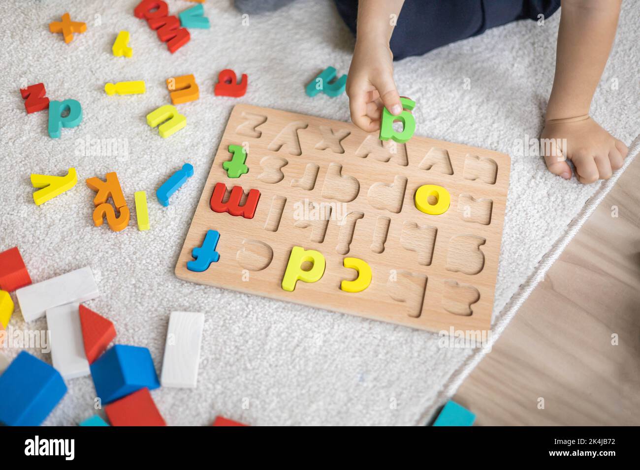 Little sweet cute baby sleeps in his bed with a toy Stock Photo - Alamy