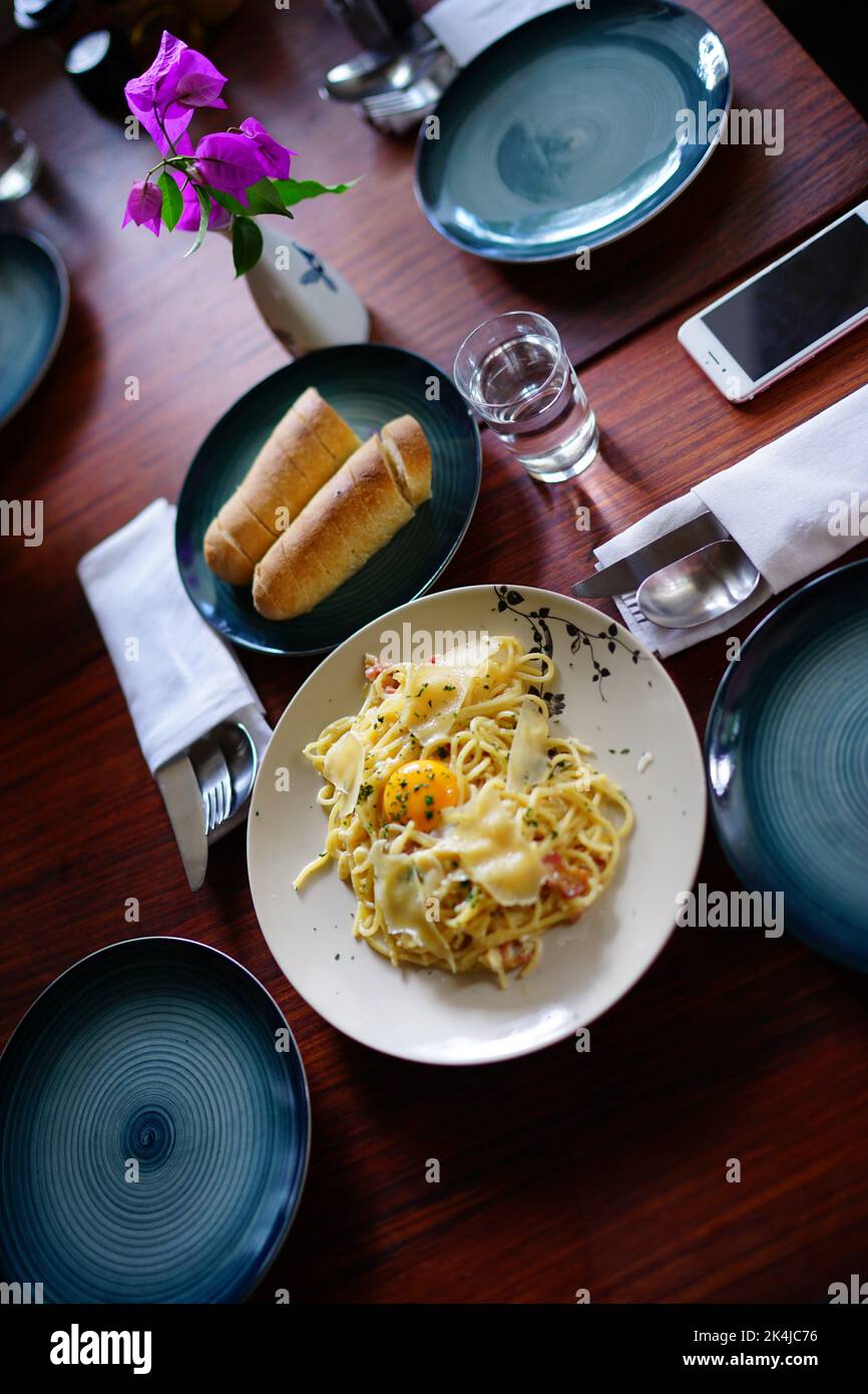 Spaghetti with egg, cheese and hams in Da Lat, Vietnam Stock Photo