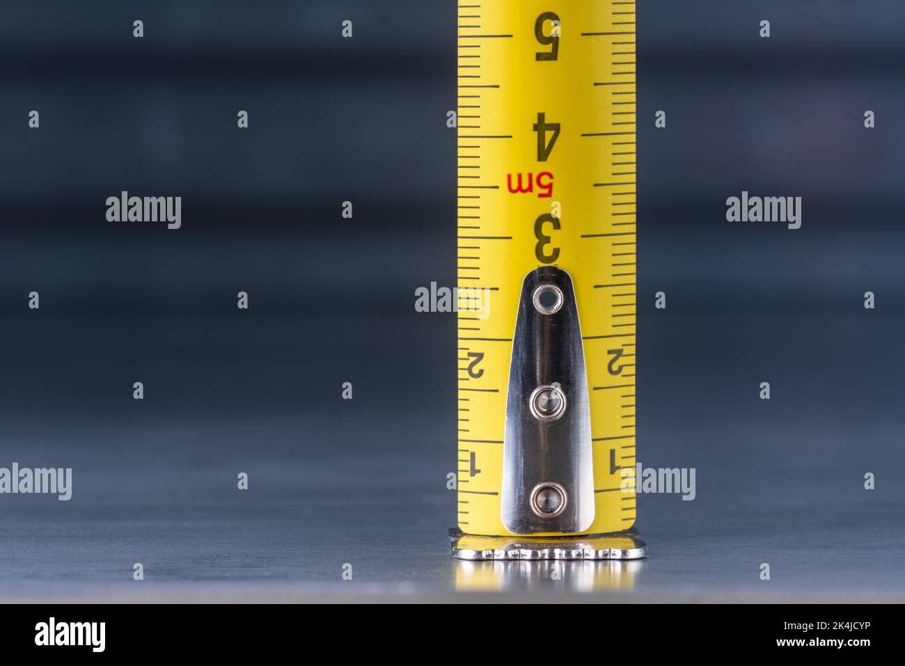 Close-up of tape measure on metal background Stock Photo