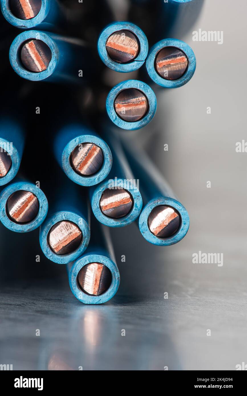 Cross section of electrical copper wire close-up on metal background Stock Photo