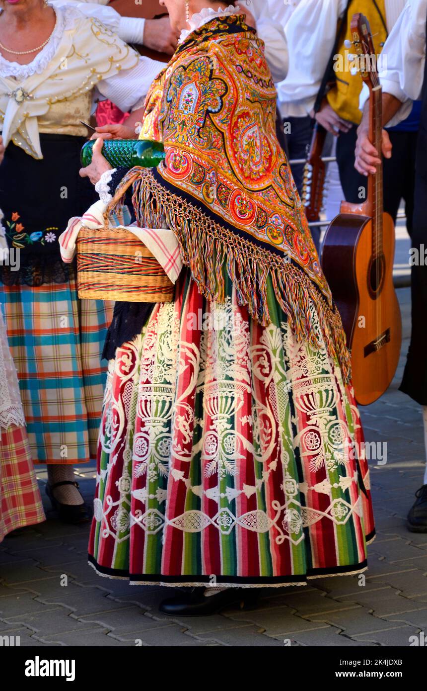 Spanish national folk costume. Woman with wicker basket. Stock Photo
