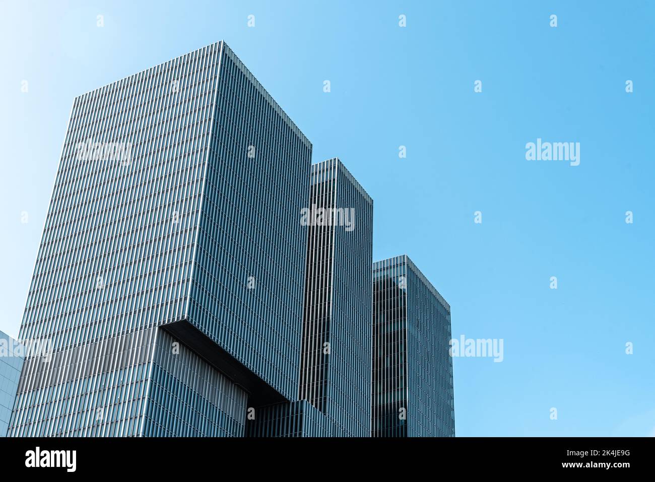 Rotterdam, Netherlands - May 8, 2022: De Rotterdam Skyscraper against sky. Designed by Rem Koolhaas architect. Contemporary architecture. Low angle vi Stock Photo