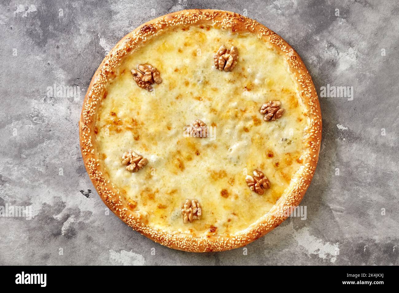 Cheese pizza with mozzarella, parmesan, emmental, walnuts