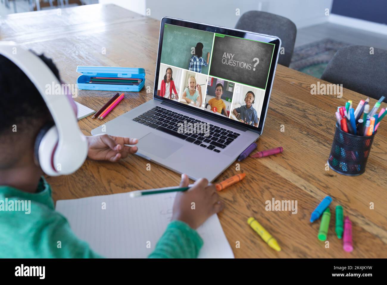 African american boy using laptop for video call, with diverse ...