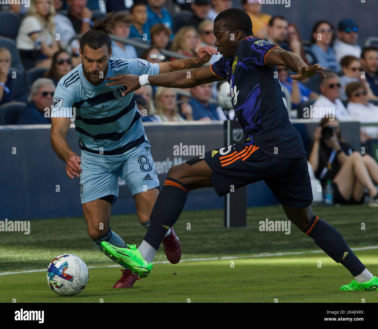Kansas City, Kansas, USA. 2nd Oct, 2022. Seattle Sounders defender Nouhou Tolo #5 (r-f) makes a defensive tackle against Sporting KC defender Graham Zusi #8 (l-b) during the first half of the game. (Credit Image: © Serena S.Y. Hsu/ZUMA Press Wire) Stock Photo