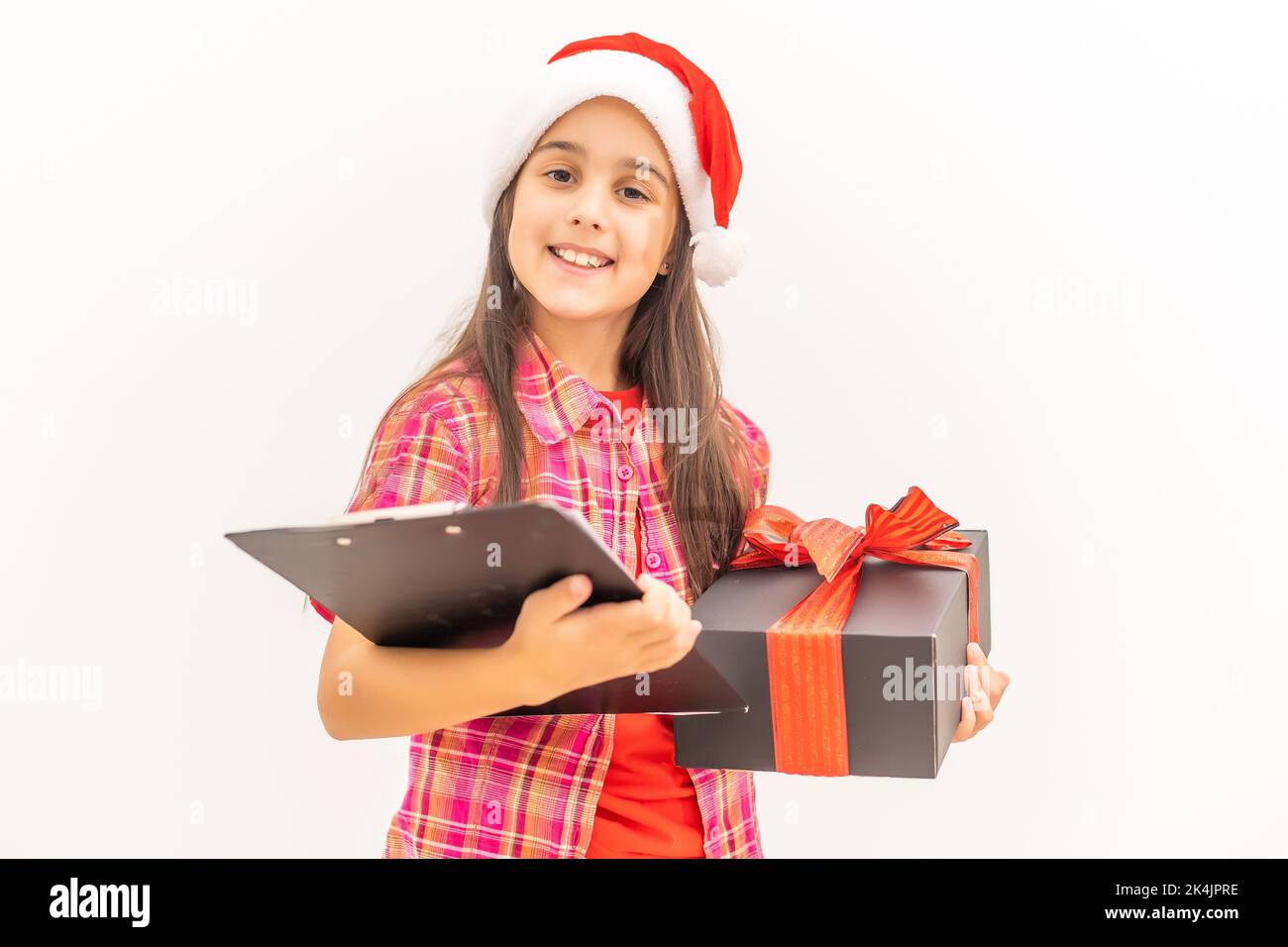 Happy little smiling girl with christmas gift box Stock Photo - Alamy