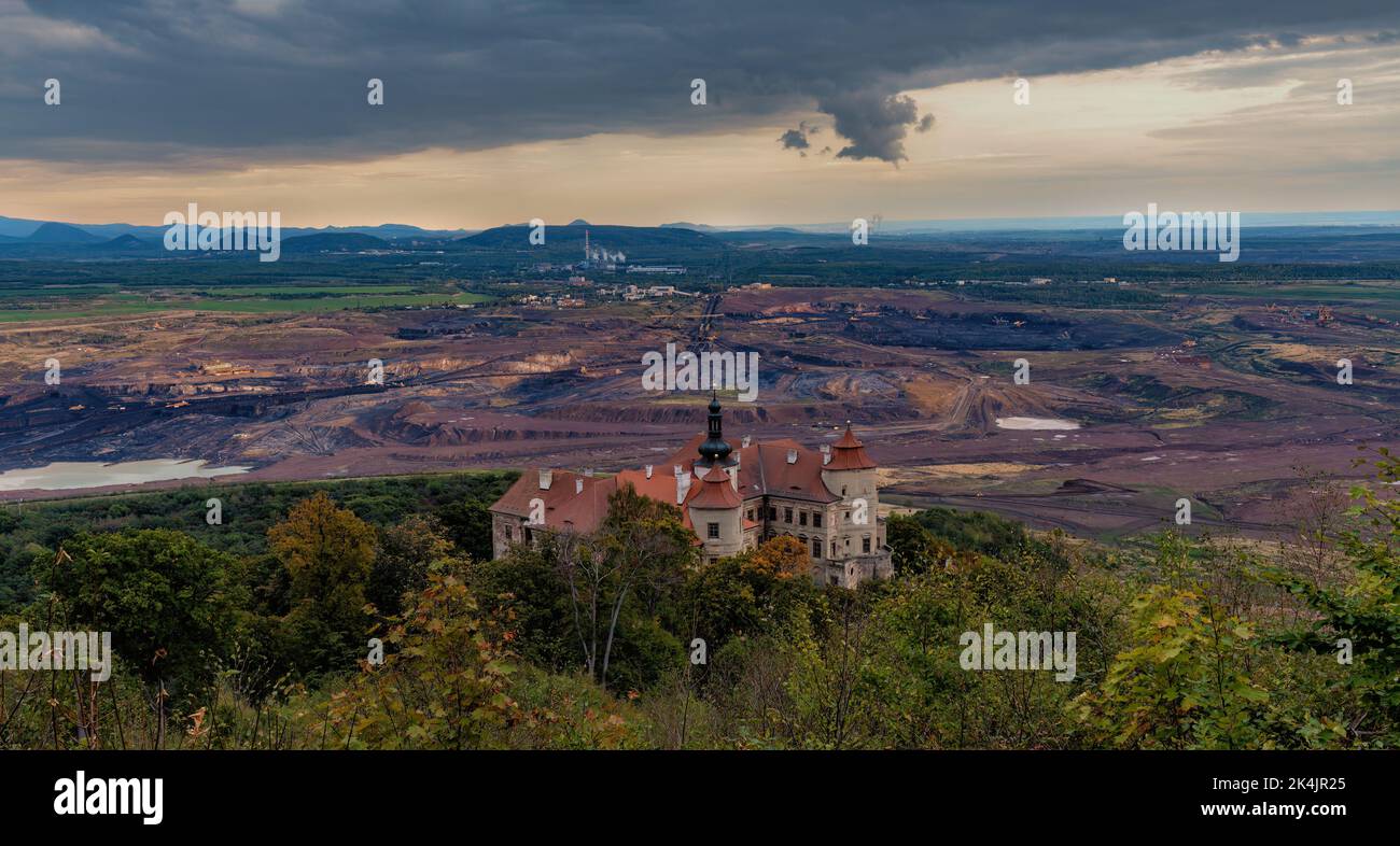 State Chateau Jezeří near Most with brown coal mines in the background - Stock Image