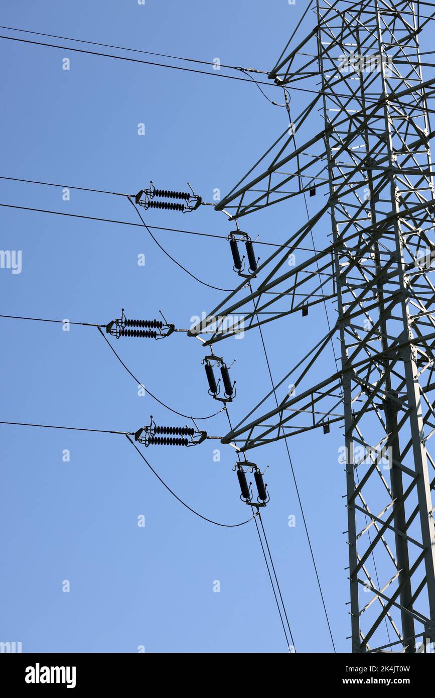 high voltage power pole and lines against the blue sky Stock Photo - Alamy