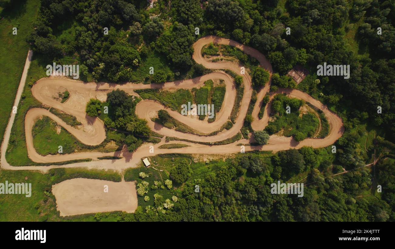 Aerial above view of a rural landscape with a curvy dirt road like a labyrinth running through it near Warsaw, Poland. High quality photo Stock Photo