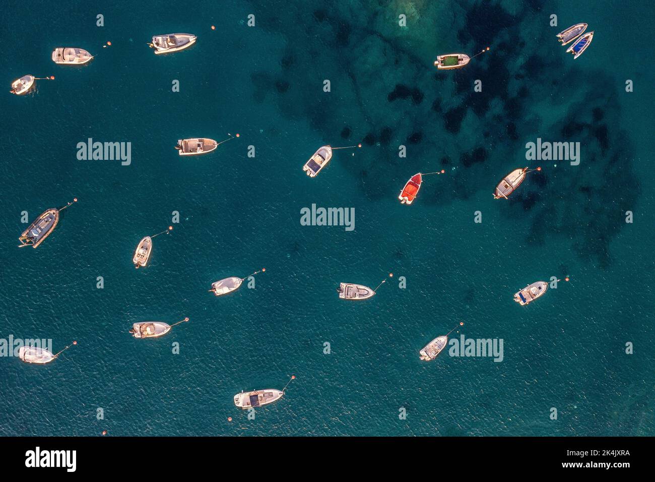 Aerial view to many rubber boats in the clear blue sea Stock Photo
