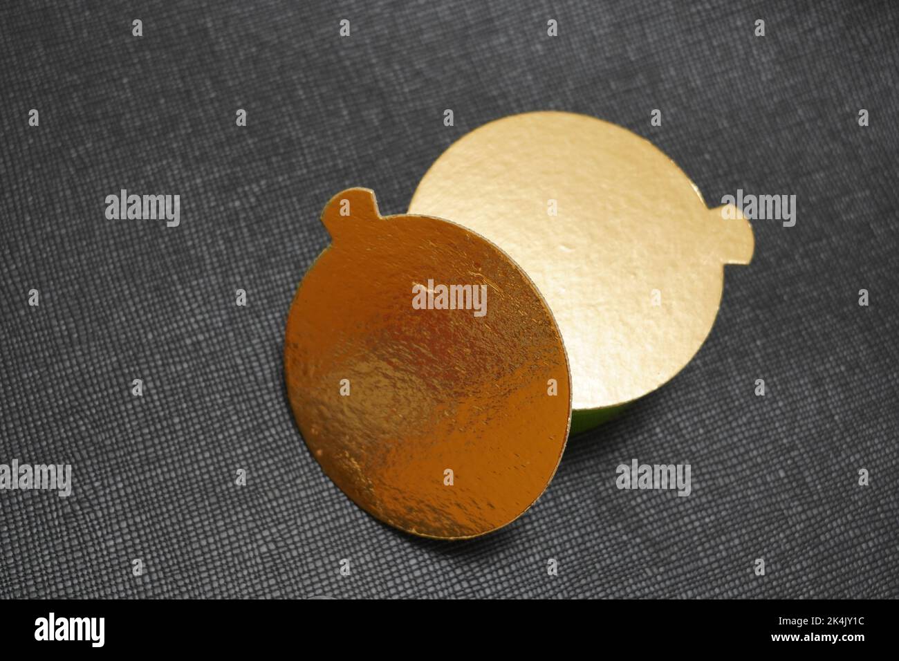 Two golden speech bubbles on a textured red background. Stock Photo