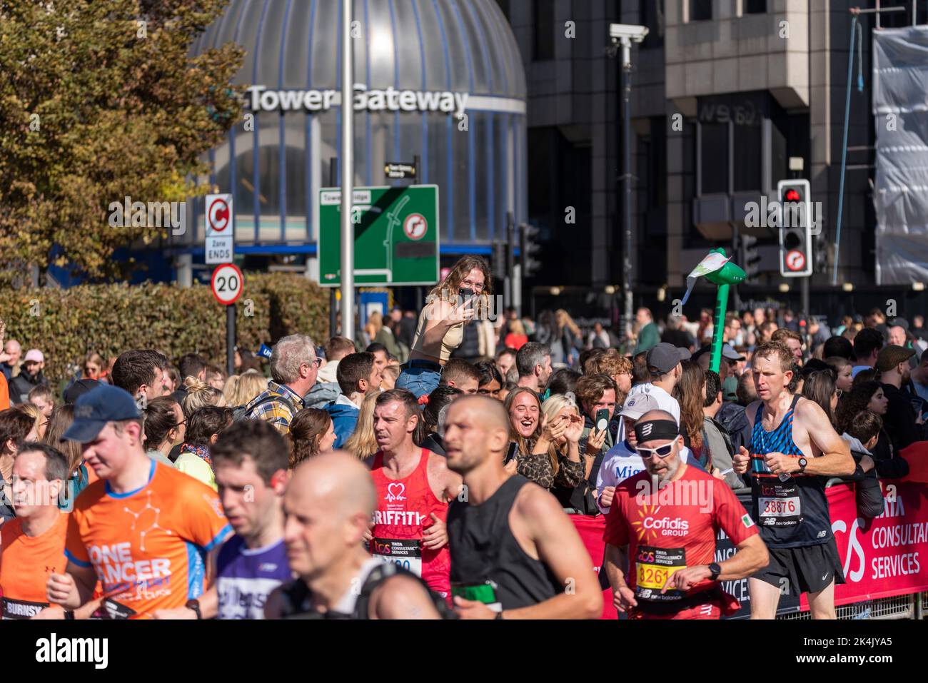 Fun runners running in the TCS London Marathon 2022, on Tower Hill road