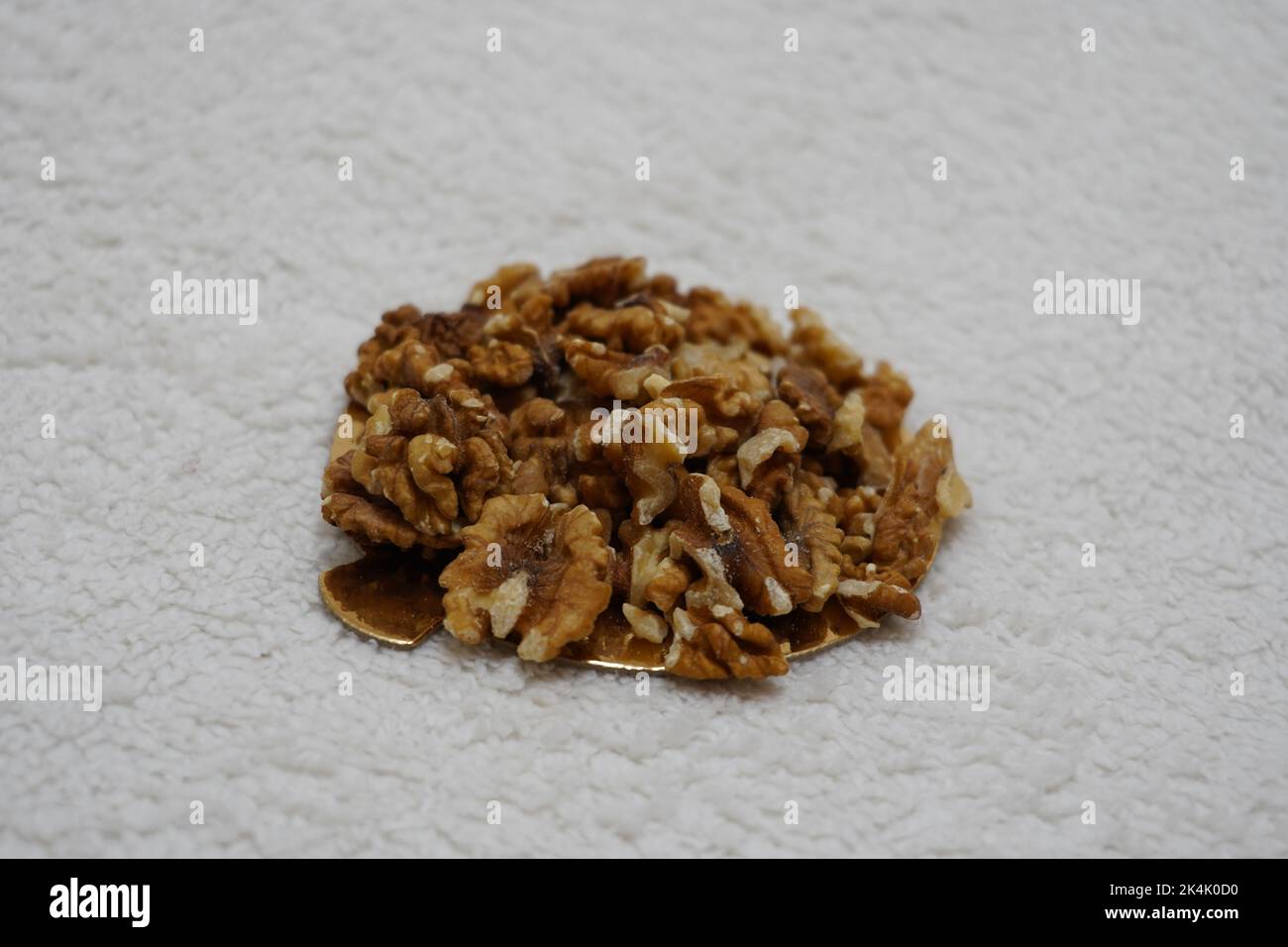black prunes in glass jar on textured white background Stock Photo Alamy