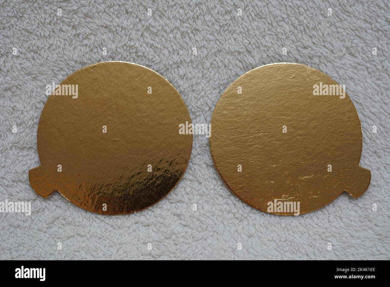 Two golden speech bubbles on a textured red background. Stock Photo