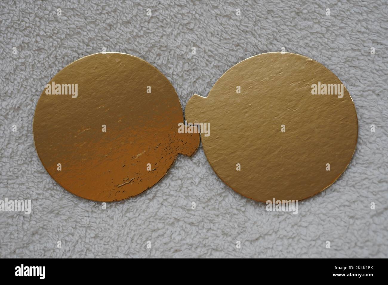 Two golden speech bubbles on a textured red background. Stock Photo