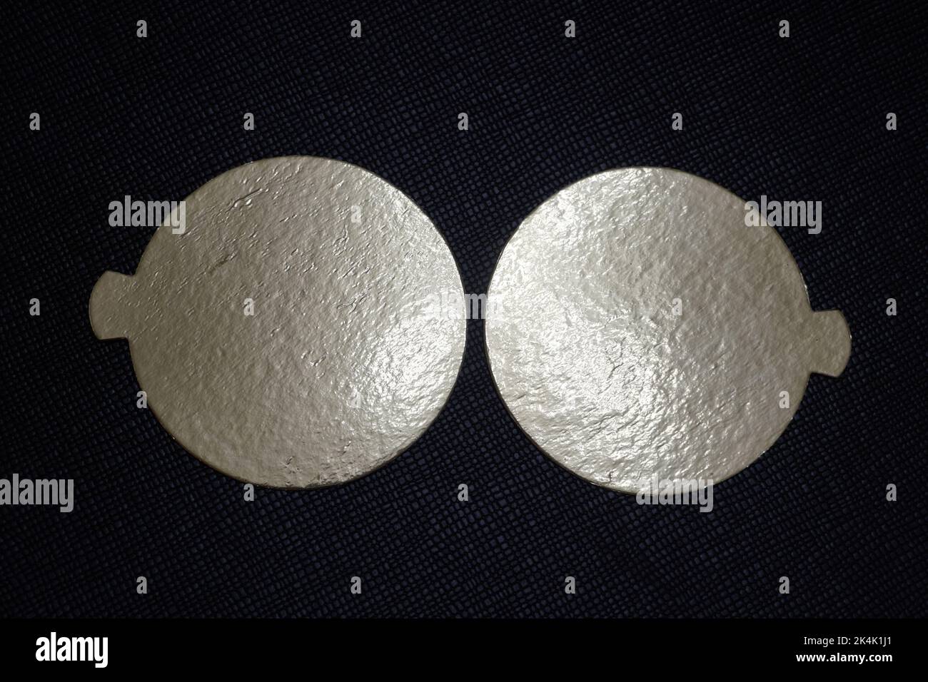 Two golden speech bubbles on a textured red background. Stock Photo
