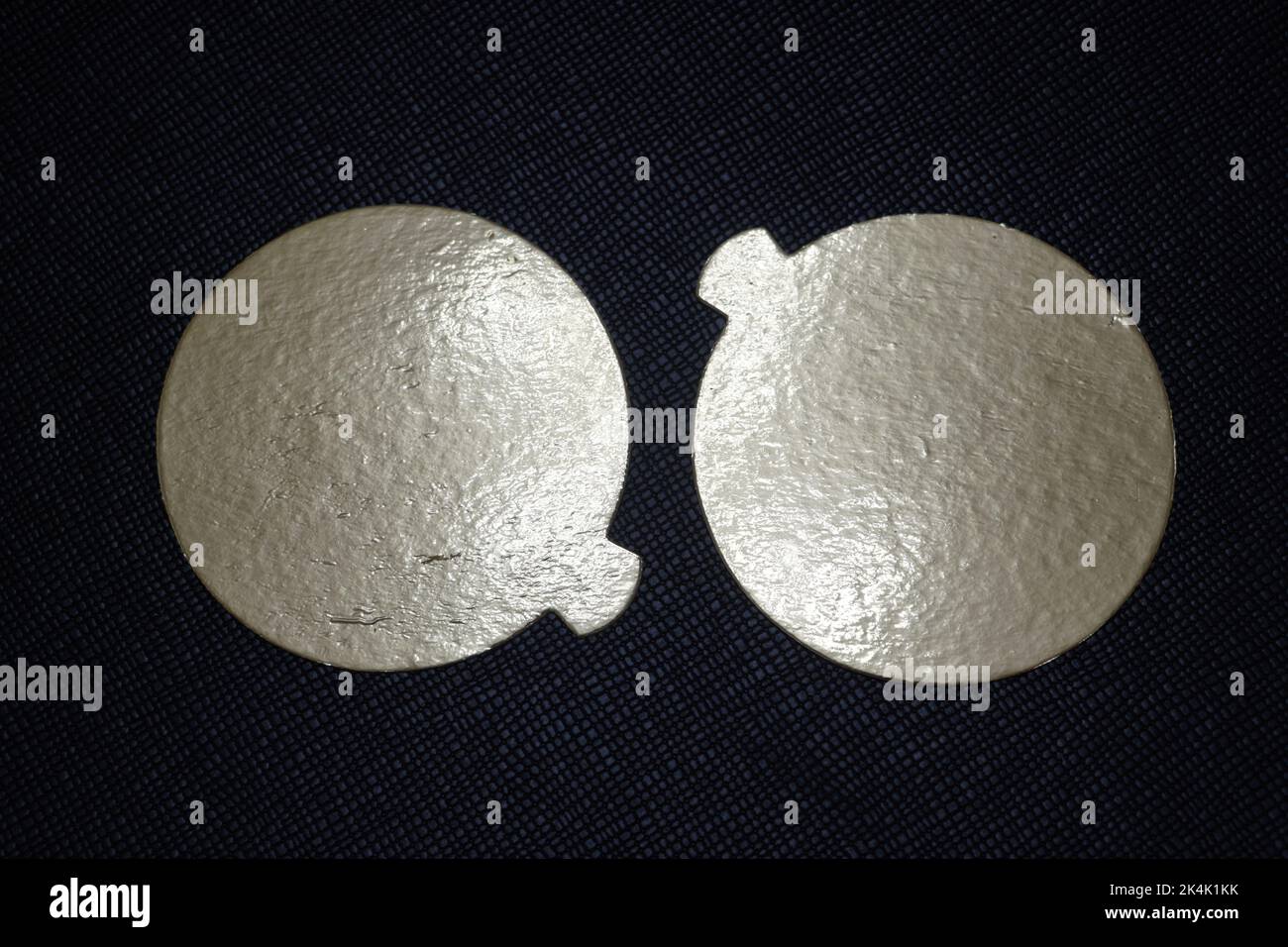 Two golden speech bubbles on a textured red background. Stock Photo