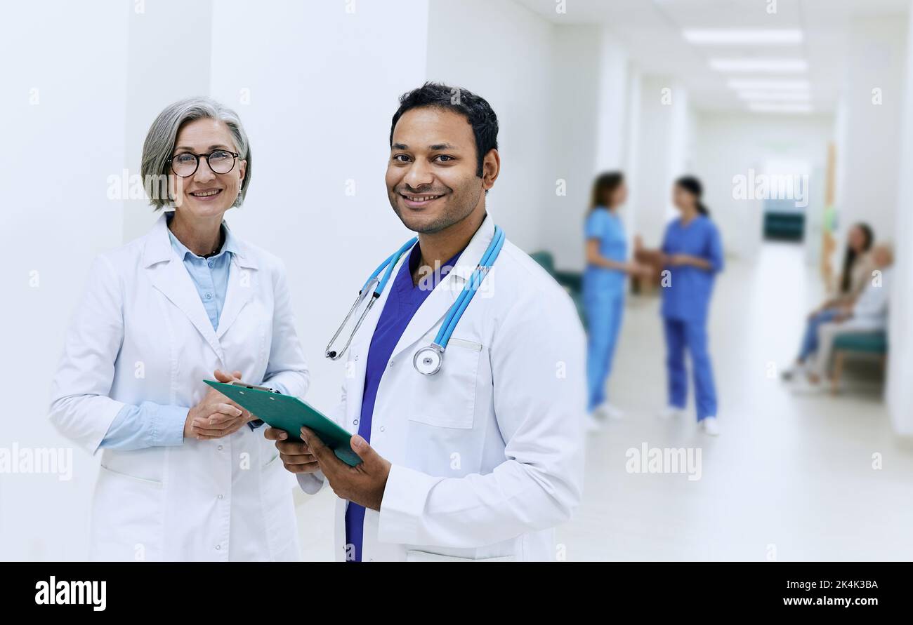 Group of doctors of different nationality in medical uniform standing
